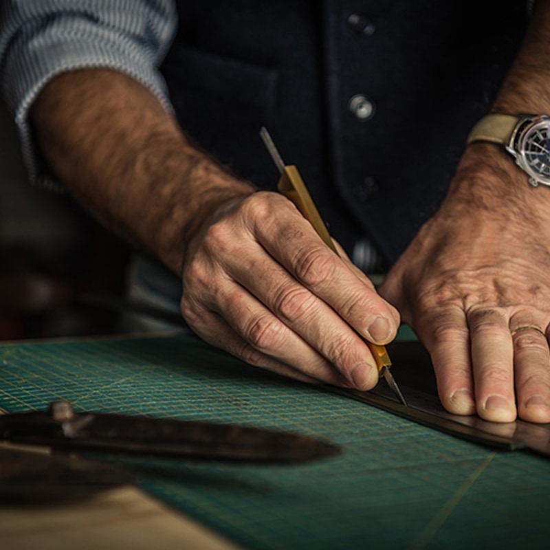 Man cutting leather