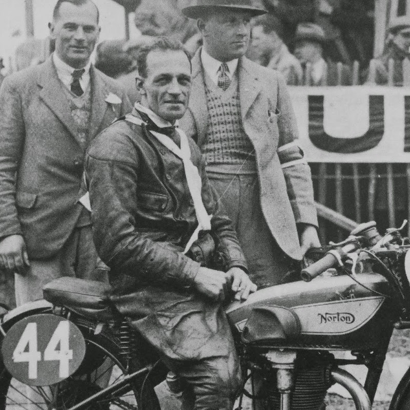 Black and white picture of man on motorbike