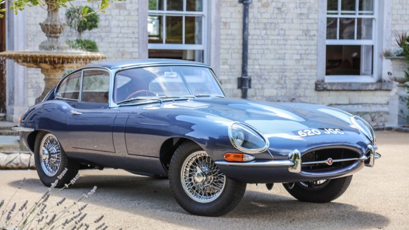 Vintage jaguar parked outside a building