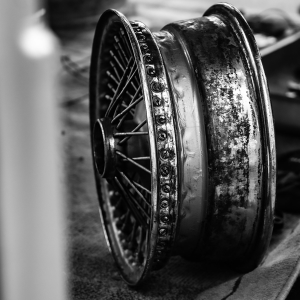 Black and white picture of car wheel without tyre