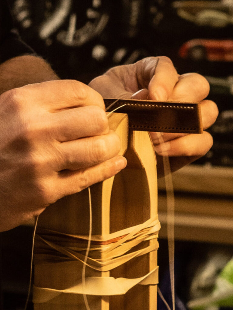 Leather strap being stitched