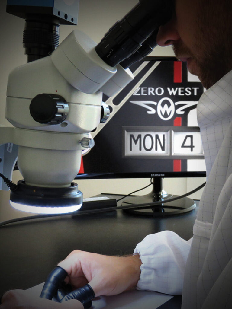 Man looking through microscope