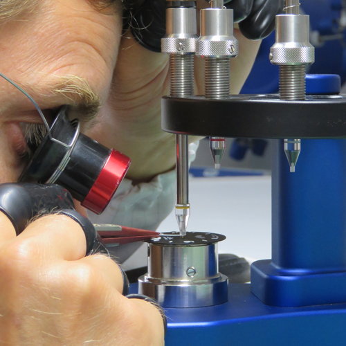 Man using watch making tool