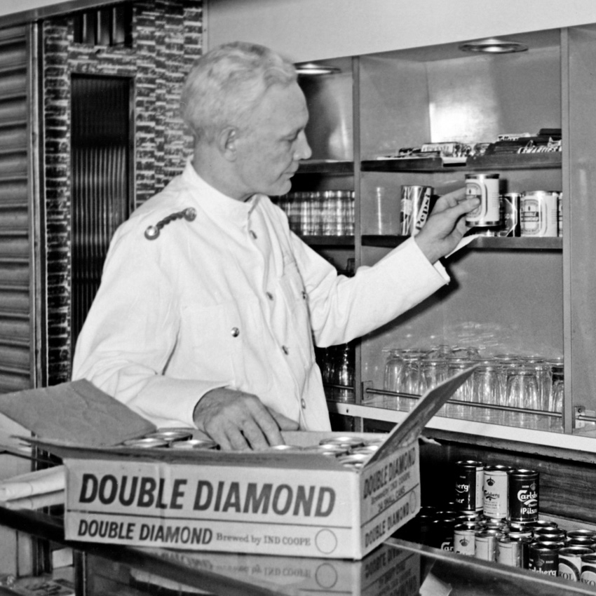 Man emptying cans from a box
