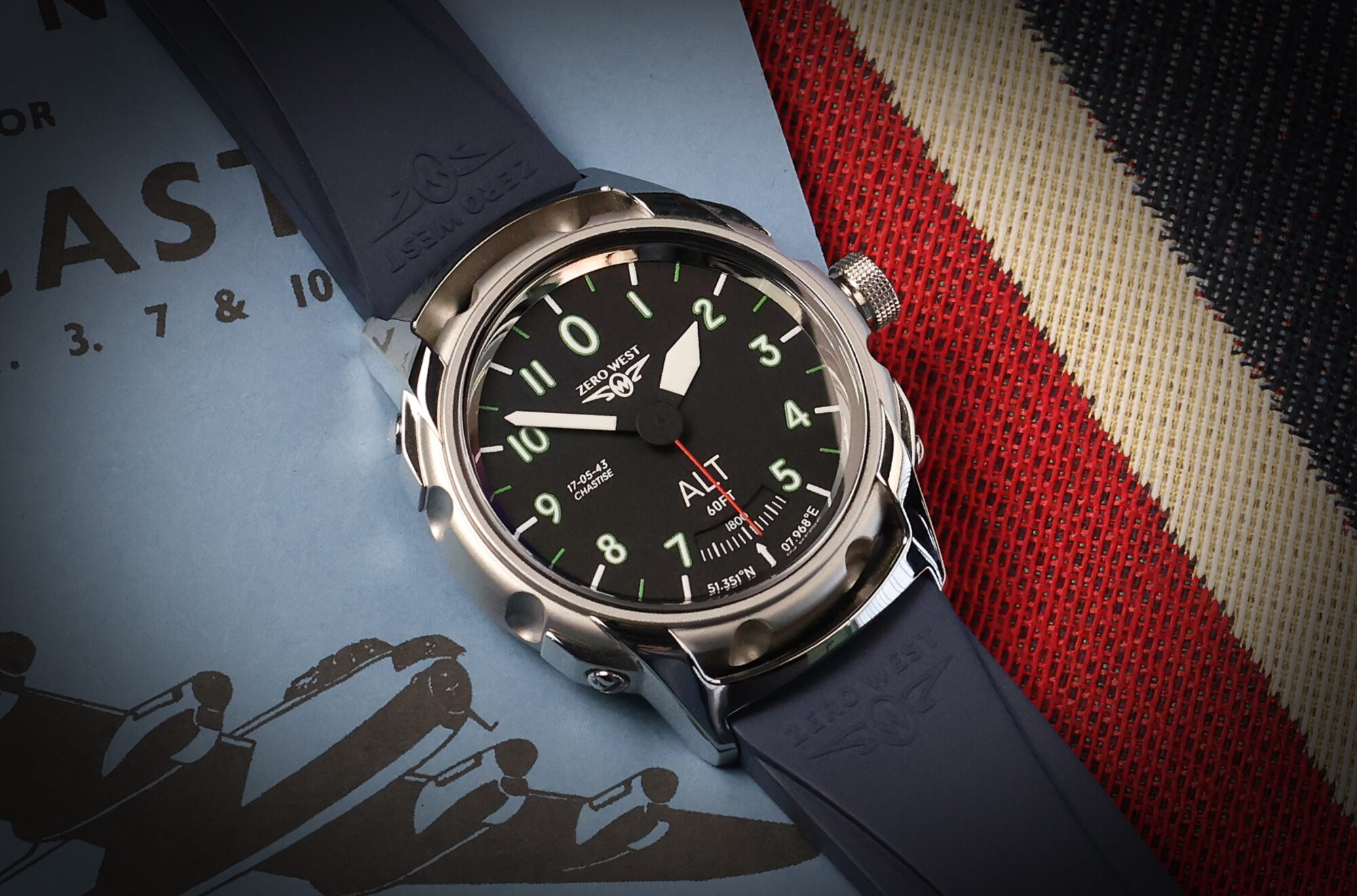 DB-80 watch with black strap on aircraft book