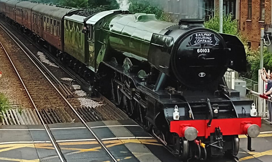 Flying Scotsman passing over level crossing