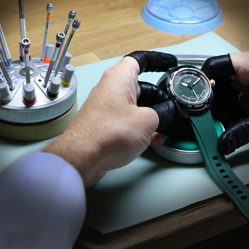 Workshop desk with H2 watch being examined